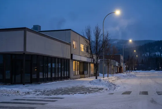 Snowy downtown street corner at blue hour